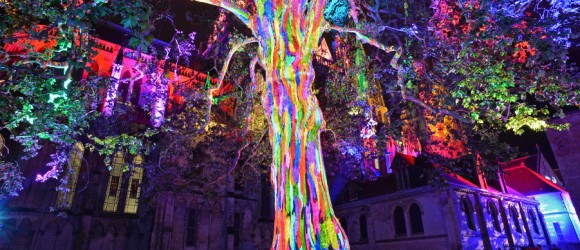Multi-coloured light show on Bayeux Cathedral at night