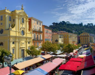 View from above of the Cours Saleya market in Nice with covered stalls and old buildings