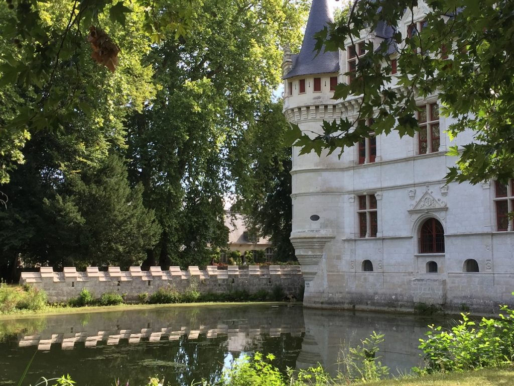 corner towers of Azay le Rideau Loire Chateau reflected in the moat