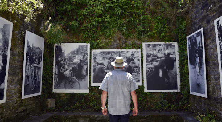 La Gacilly photo festival. Man in front of photos outdoors