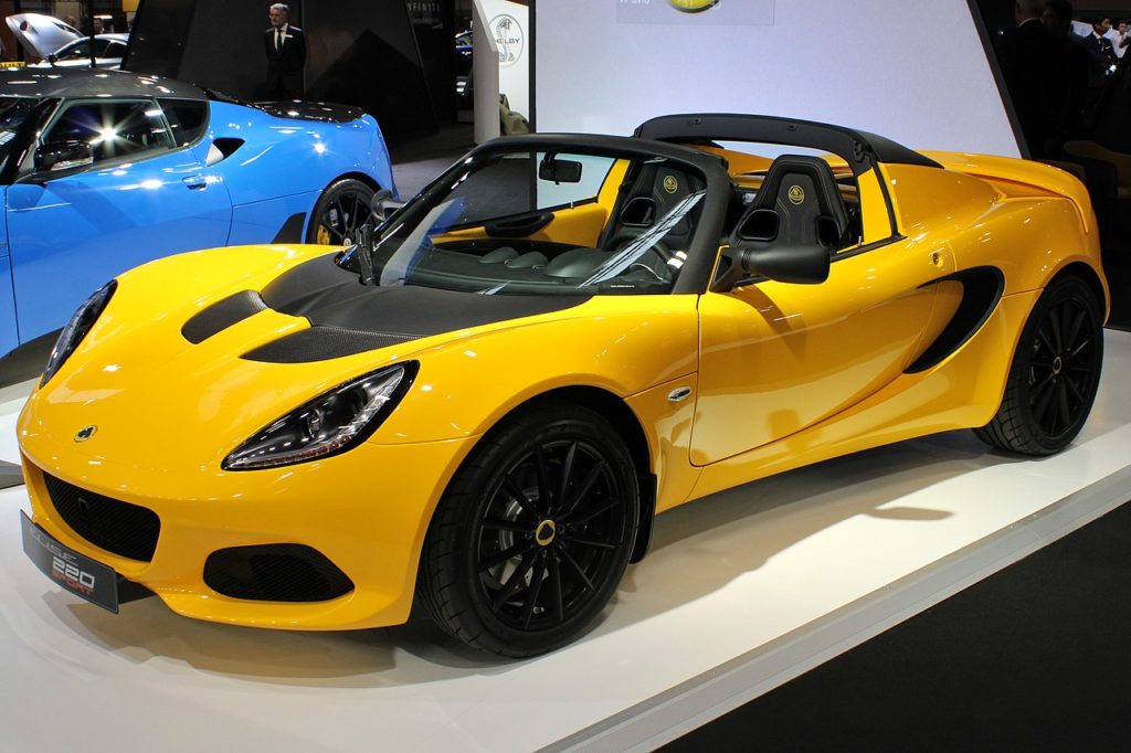 Yellow lotus elise sport at the Paris motor show on a stand