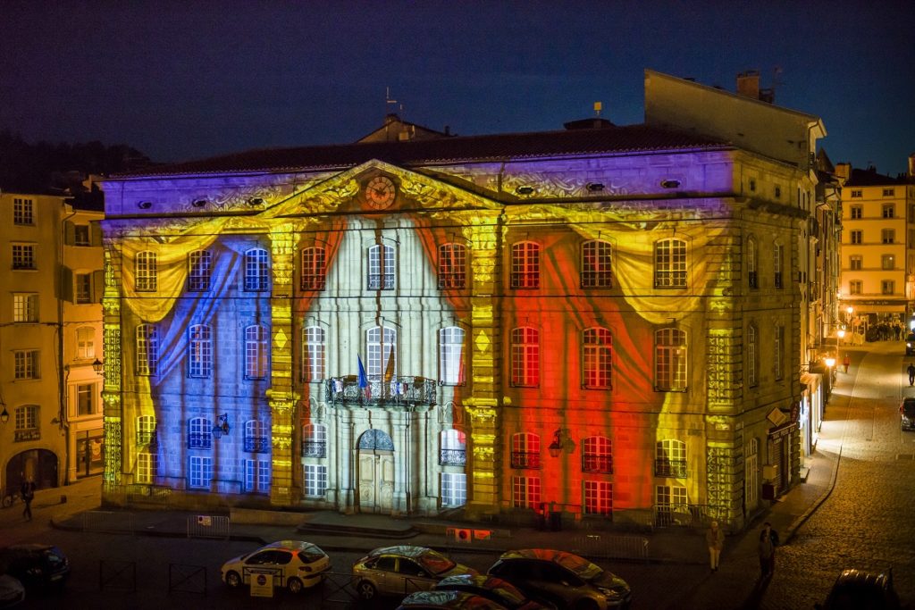Le Puy en Velay mairie lit up with red white and blue 