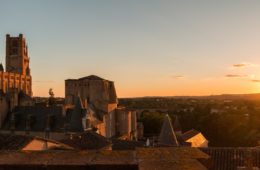 Albi in twilight with cathedral and museum to left all in golden sunset