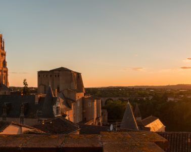 Albi in twilight with cathedral and museum to left all in golden sunset