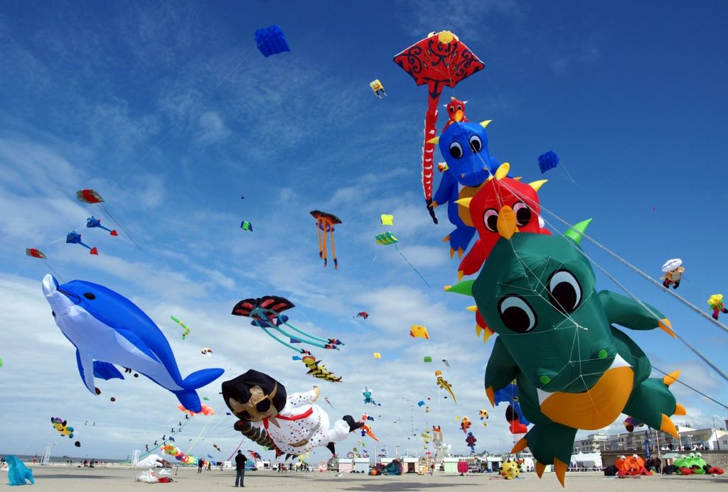 kites flying i nthe sky at Berck Kite Festival e