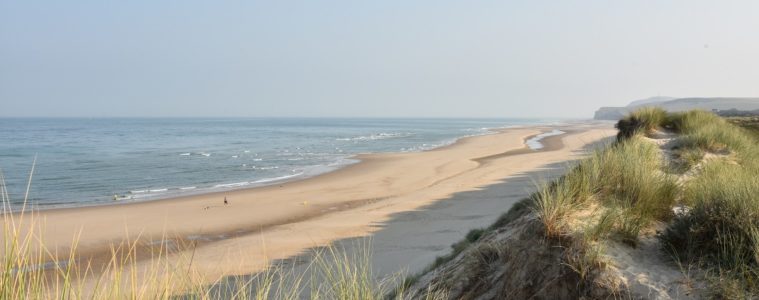 Opal coast north France long sandy beach with dunes in background and sea in front