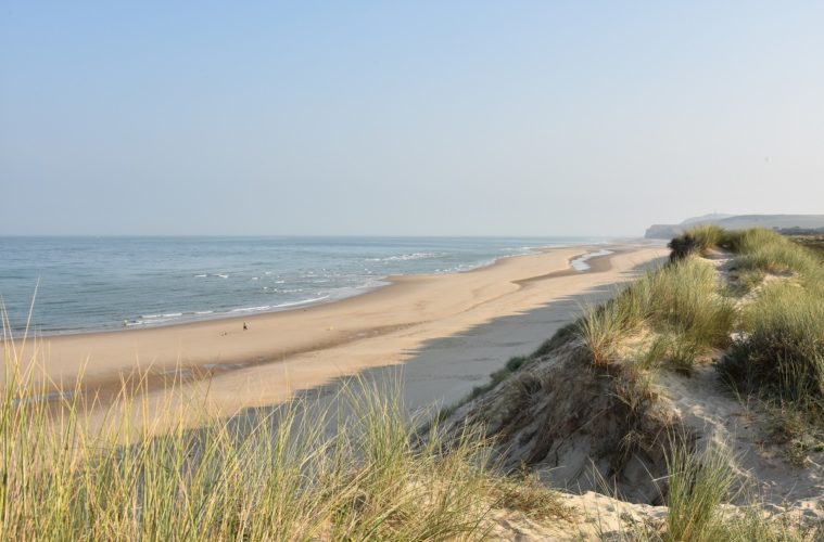Opal coast north France long sandy beach with dunes in background and sea in front
