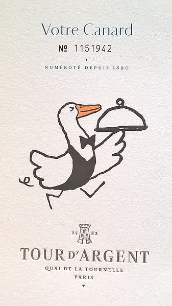 Menu for pressed duck at La Tour d'Argent with cartoon duck carrying a silver dome