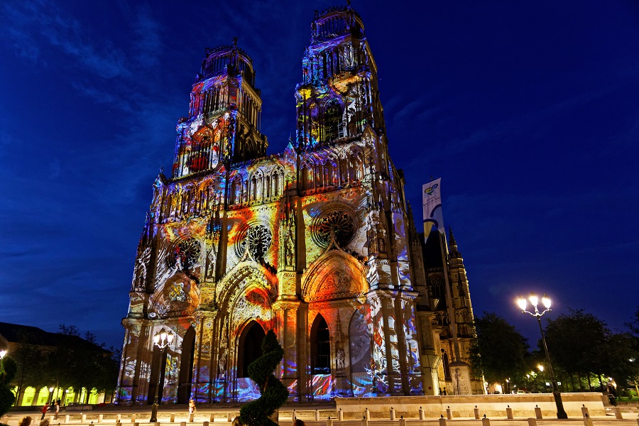 Sound and light show on Orleans cathedral with multi colours on facade
