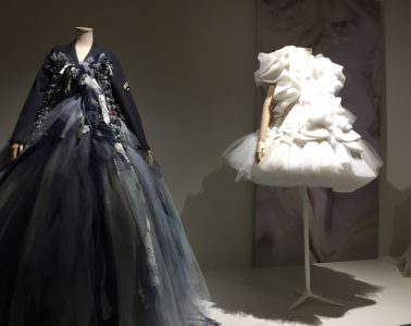 Lace and Fashion museum Calais with two models, one wearing short white dress and the other, closer, in black