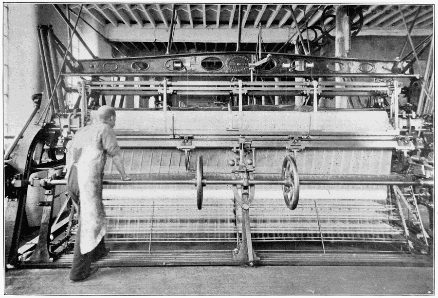 Old black and white print of Leavers lace making machine in Industrial Revolution with huge rollers and one operative in front