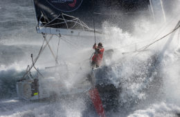 Boris Herrman in racing boat for Vendee Globe. Looking down through a p0lume of spray to the lone sailor