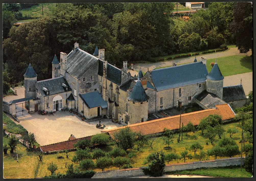 Looking down on Chateau Terre Neuve in the Vendee showing gardens at bottom and L shaped chateau of stone with slate roof