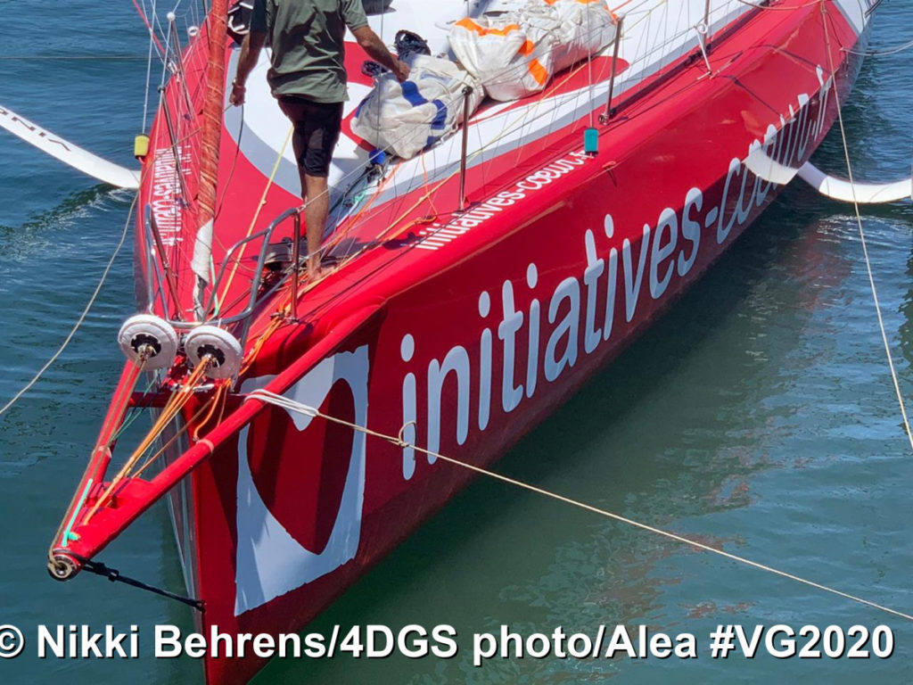 Sam Davies sauiling into Cape Town as she leaves the Vendee Globerace after boat damage l.Image looking down onto the boat with Sam Davies on front