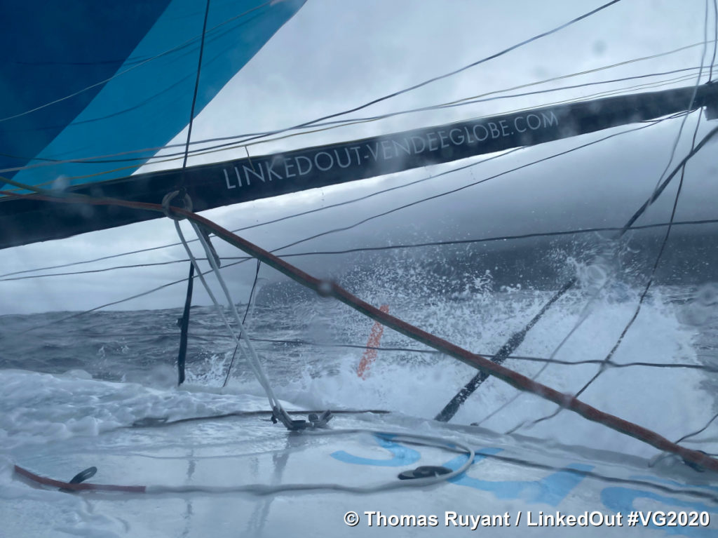 Thomas Ruyant LinkedOut photo from boat of large waves seen through sail, and ropes in the Vendee Globe 2020