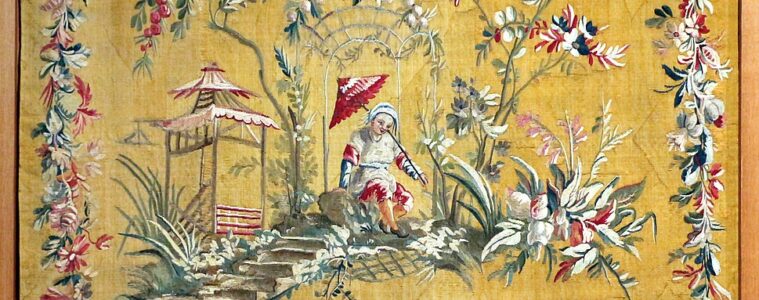 Aubusson tapestry showing bright yellow/orange background and chinoiserie scene of Chinese people with borders of woven flower garlands