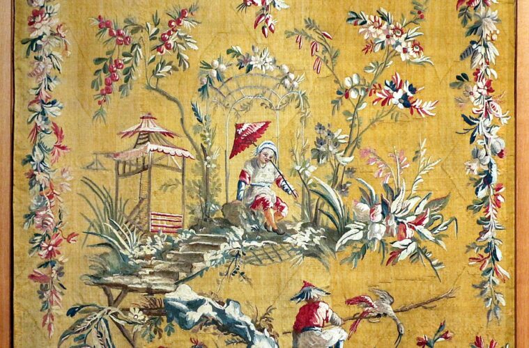 Aubusson tapestry showing bright yellow/orange background and chinoiserie scene of Chinese people with borders of woven flower garlands