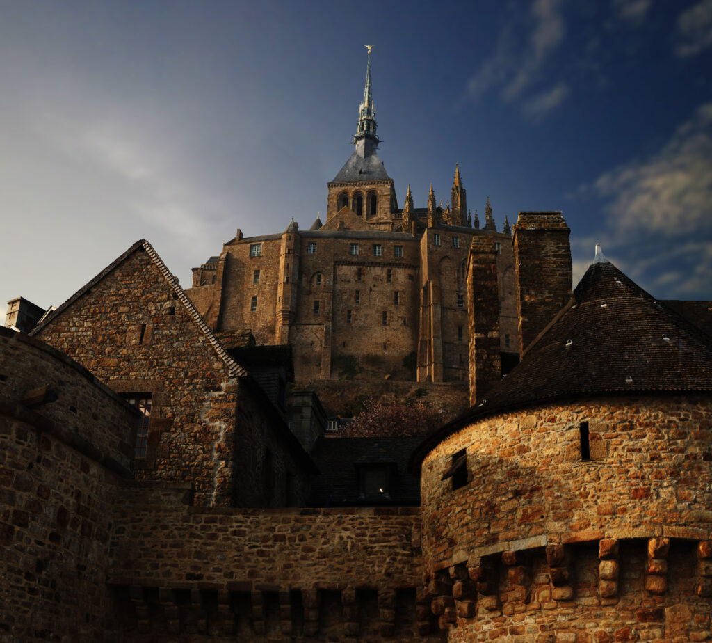 View of Mont St Michel looking up from the ramparts. Dramatic shot with lots of shadow