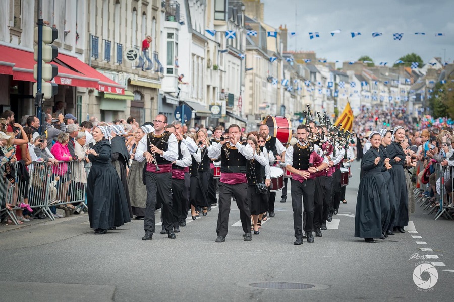 Filets Bleus Festival Brittany with procession in traditional Breton costume in the streets