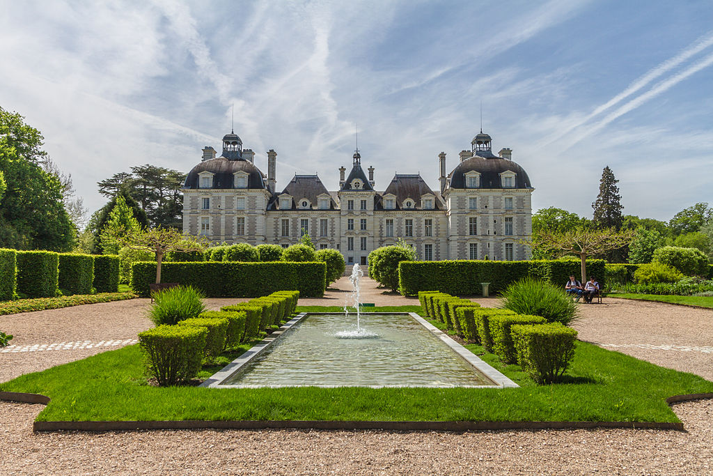 Chateau de Cheverny Loire Valley gardens showing view of chateau (Tintin's) in background with long water with formal beds and state in front