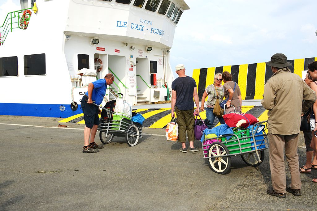 Getting onto the ferry to Ile d'Aix withpeople with large handcarts pushing them up ramps
