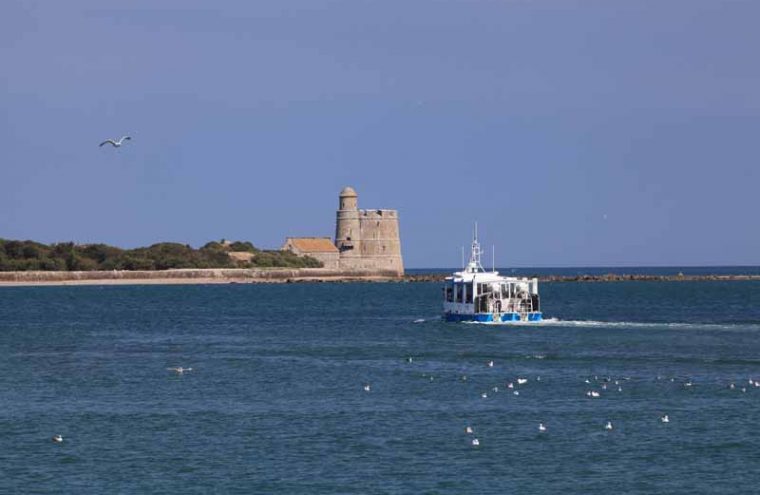 View from sea with amphibious boat in water approaching Tatihou fort France
