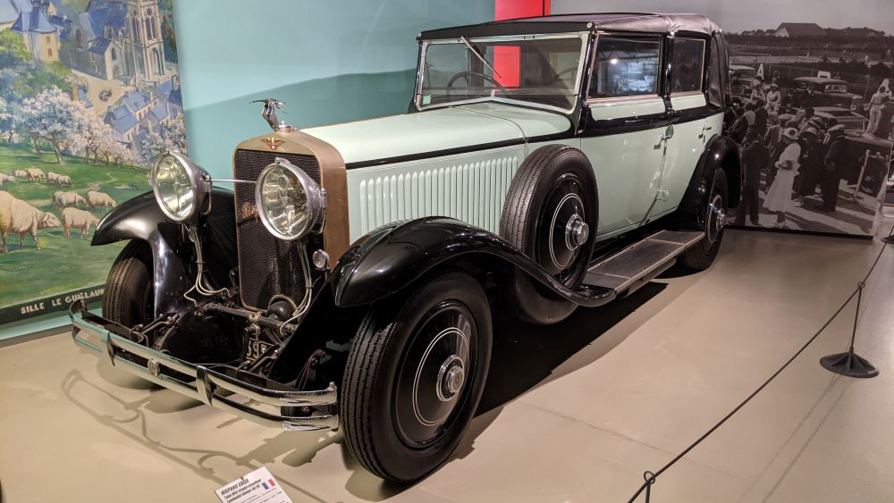 Classic old Mercedes Benz in Le Mans museum showing pale coloured saloon