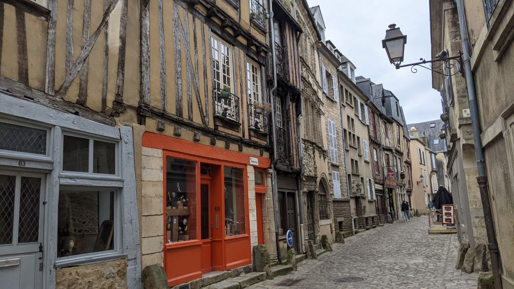 Narrow cobbled street in Le Mans with half timbered houses and cobble stones
