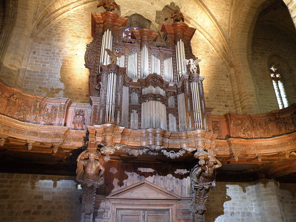 Magnificent organ at La Chaise-Dieu, Auvergne. Huge pipes and elaborate wood work in elevated position