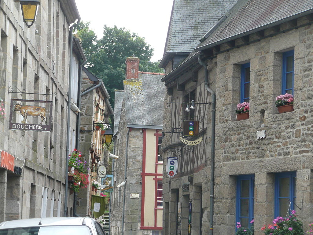 Moncontour street of tall half timbered and stone houses in narrow street