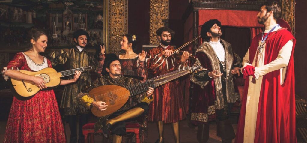 Chambord at Christmas showing group of Renaissance musicians dressed in part playing old instruments