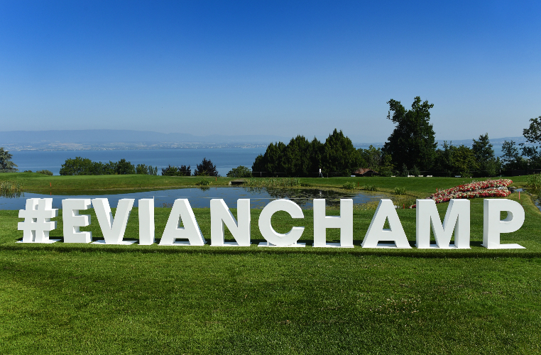 Large white sign on golf course saying Evian championship