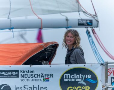 Kirsten Newschafter on boat showing smiling skipper on her yacht in harbour