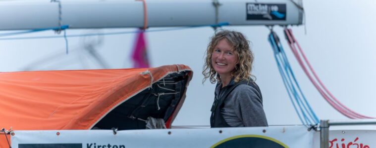 Kirsten Newschafter on boat showing smiling skipper on her yacht in harbour