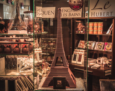 Paris chocolate show with models of buildings made of chocolate like Eiffel Tower with names of places in chocolate behind