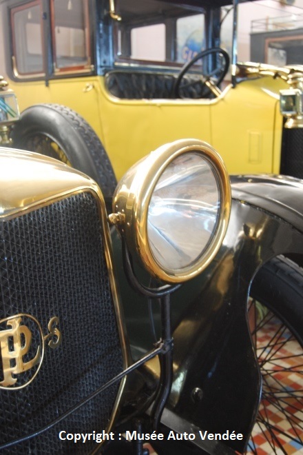 Vendee Car Museum with close up of front of Panhard 1914 showing headlight, and bonnet