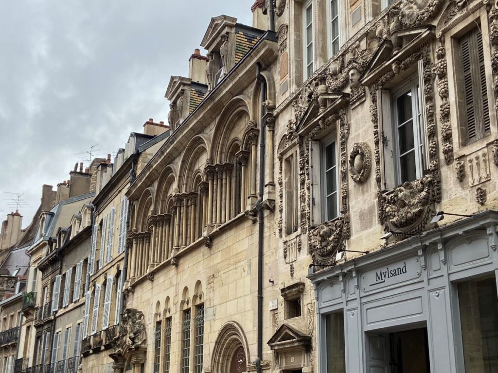 Street of Renaissance stone houses in Dijon with elaborate carvings
