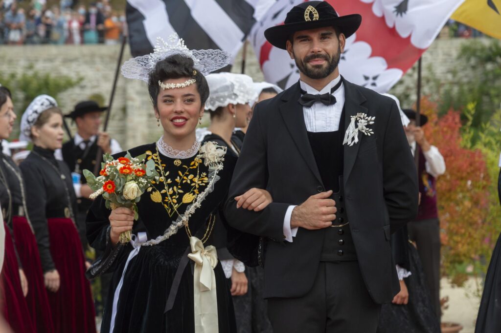 FEstival d'Arvor Brittany with a coupld both in elaborate Bereton costumes arm in arm