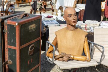 Roire de chatou with Vuitton boxes and mannequin figure on table