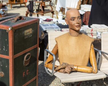 Roire de chatou with Vuitton boxes and mannequin figure on table