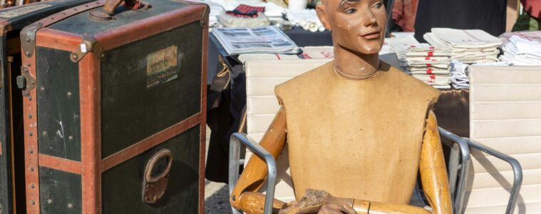 Roire de chatou with Vuitton boxes and mannequin figure on table
