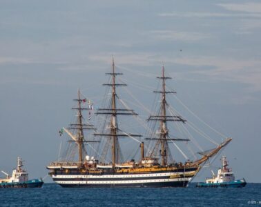 Amerigo Tall Ship with huge 3-masted boat with sails furled on sea