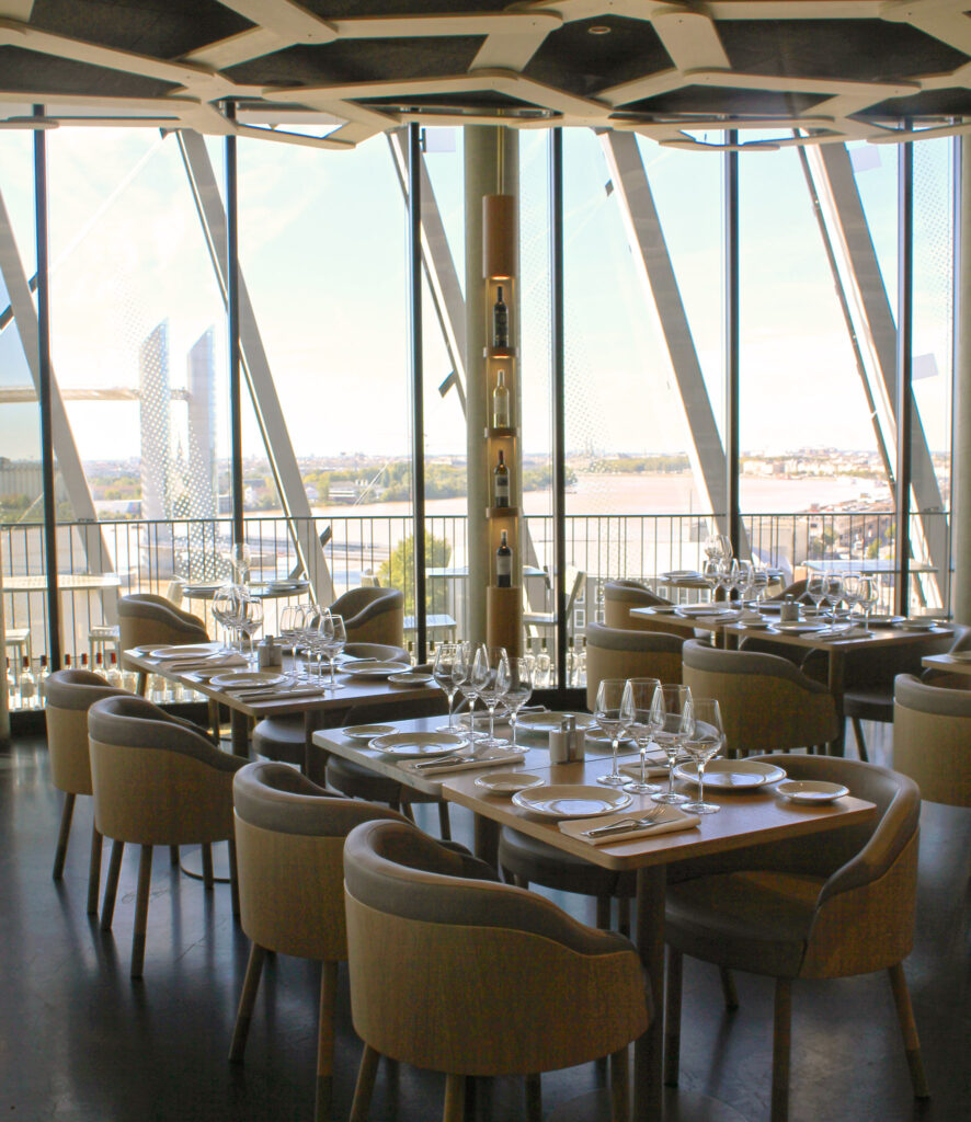 Le 7 view with empty tables in front and huge view through glas windows