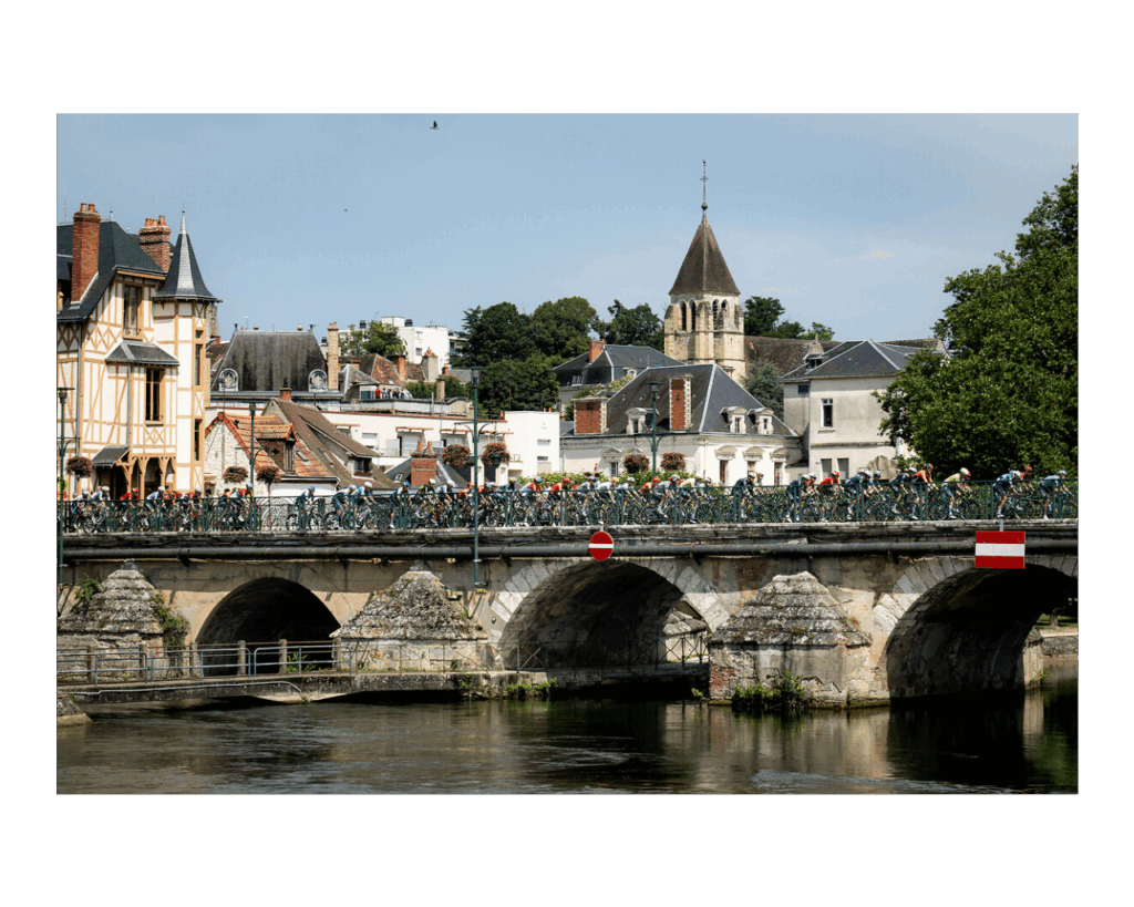 Tour de France 2024 stage 10 cyclists on bridge over river Loire at Orleans