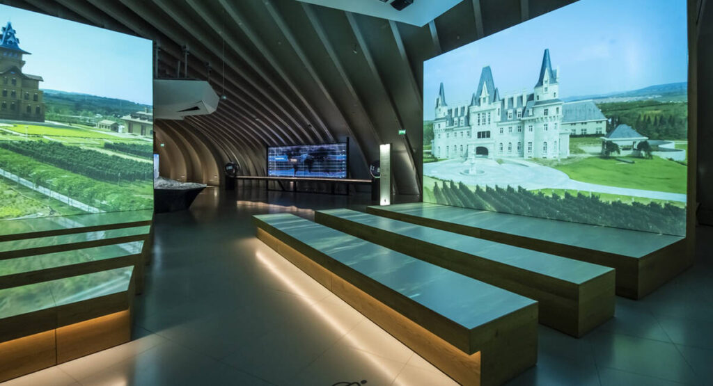 cite du vin in emplty room with benches and large screens
