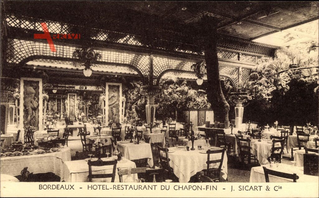 Le chapon Fin old black and white photo with tables and chairs and grotto