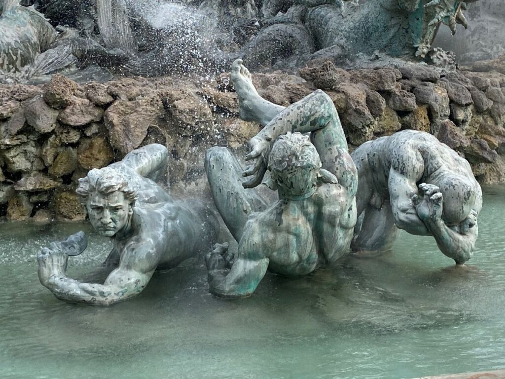 Quinconces Bordeaux fountain with three bronze statues of grappling Greek gods in water