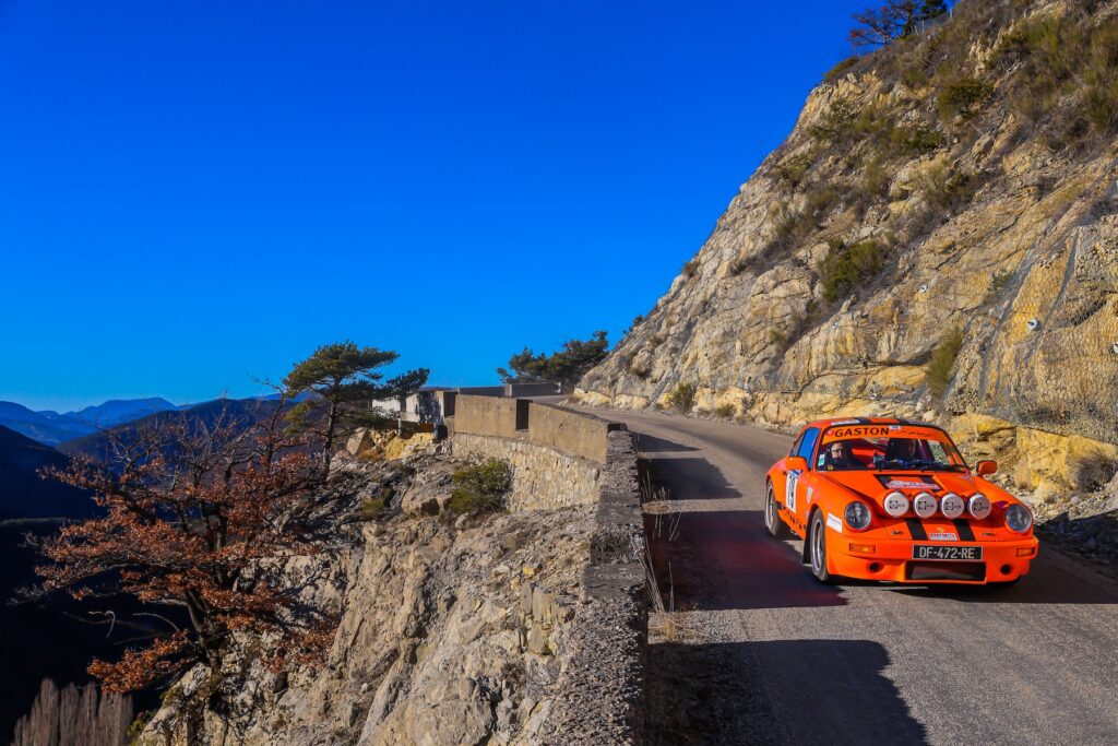 Monte Carlo histori rally with vintage red car on mountian road