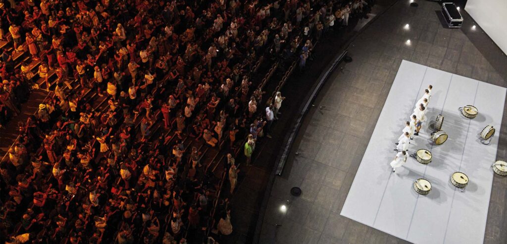 Avignon Festival view of stage with white dancers and audience from above