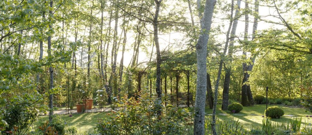 chaumont-sur-Loire english garden with trees, green grass and stones